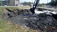 June 2017 - Using a bucket auger to mix cement and contaminated soil (ISS) west of River Road