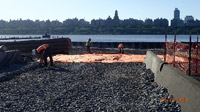 June 2018 - Installing construction fabric over finished ISS area in preparation for installing crushed stone.